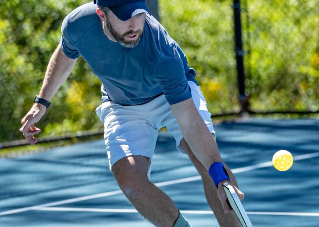 Pro pickleball player on outdoor court