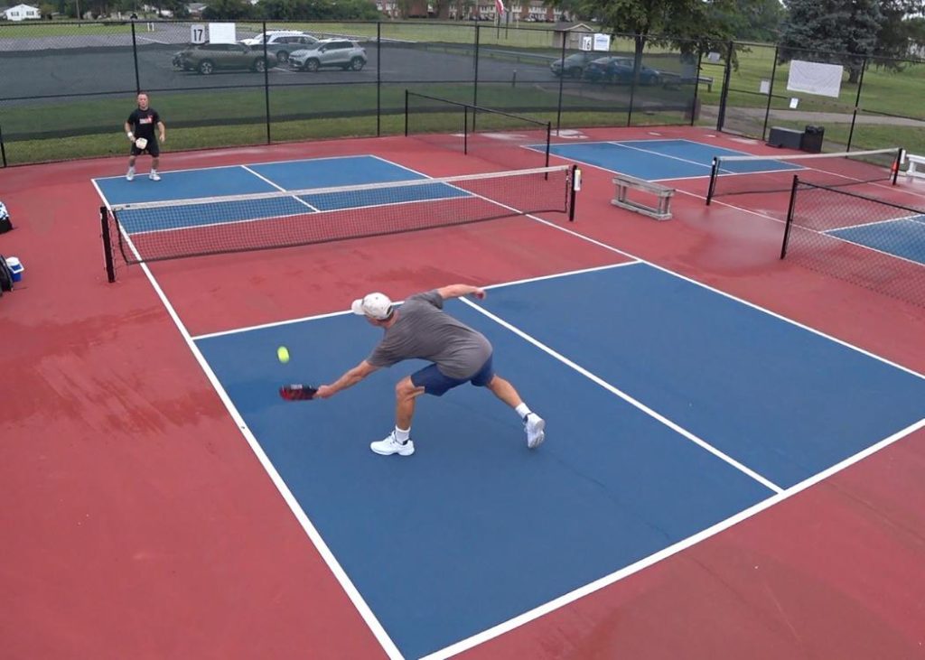 Two men playing at a pickleball tournament
